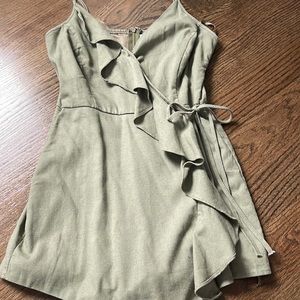 Green little romper. Only worn once. Zipper on the back. Size small.